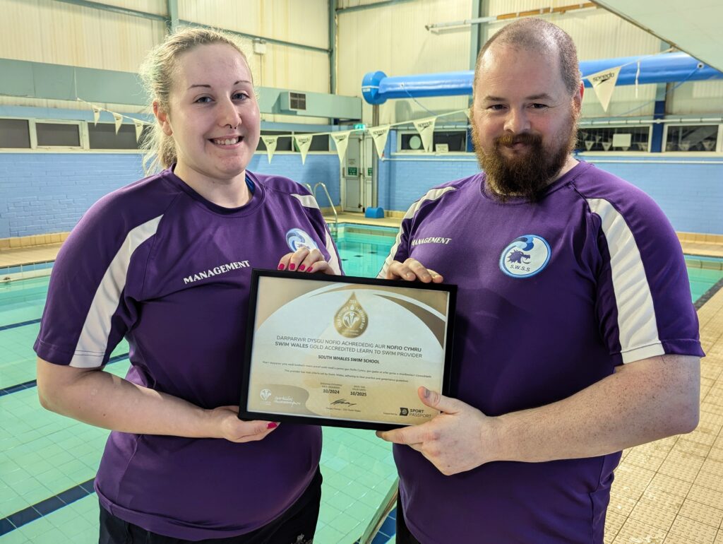 South Whales Swim School holding Gold Accreditation Certificate
